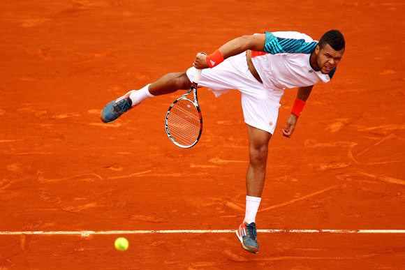 Jo-Wilfried Tsonga of France serves during his men's singles second round match against Cedrik- Marcel Stebe of Germany