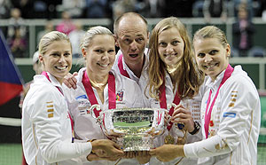 Czech Republic's team members (from left to right) Andrea Hlavackova, Lucie Hradecka, captain Patr Pala, Petra Kvitova and Lucie Safarova celebrate with the trophy after winning their final match of the Fed Cup tennis tournament against Serbia