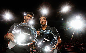 Mahesh Bhupathi (R) and Rohan Bopanna of India pose with their trophy after victory  at the Paris Masters on Sunday