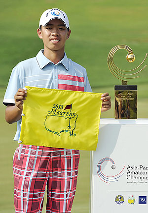 Guan Tianlang of China holds a certificate of invitation to the 2013 US Masters Tournament