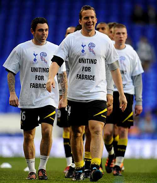 Kevin Davies of Bolton warms up with teammmates wearing t-shirts in support of teammate Fabrice Muamba