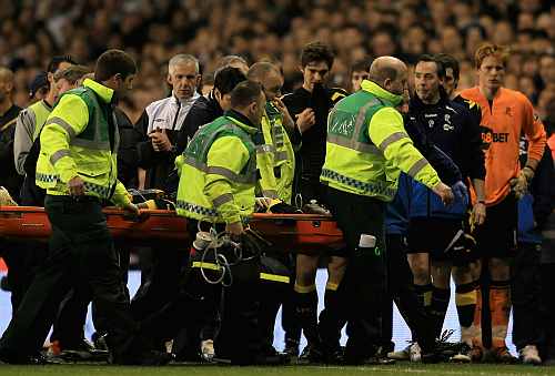 Fabrice Muamba of Bolton Wanderers is taken off on a stretcher, still unconscious after receiving CPR treatment on the pitch