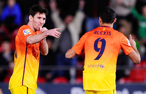 Barcelona's Lionel Messi celebrates after scoring against Real Mallorca on Sunday