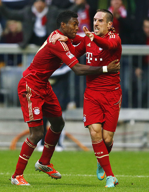 Franck Ribery (right) of Bayern Munich celebrates with teammate David Alaba after scoring against Eintracht Frankfurt