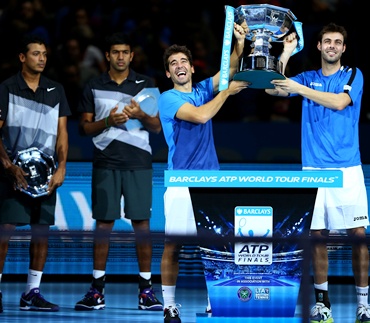 Marcel Granollers and Marc Lopez with the trophy