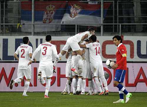 Serbia's players celebrate after scoring during their internatioanl friendly soccer match