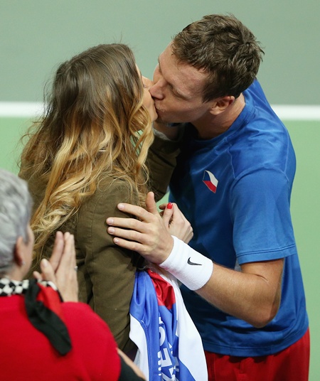 Tomas Berdych of Czech Republic kisses his girlfriend Ester Satorova