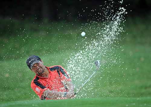 Michael Campbell of New Zealand plays a bunker shot during the final round of the UBS Hong Kong open