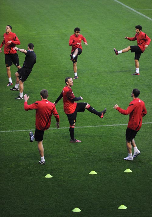 Manchester United players warm-up before a match
