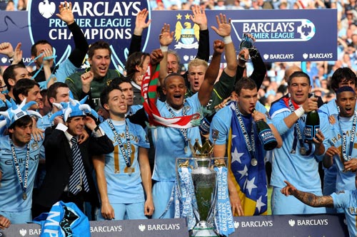 The Manchester City players celebrate with the Barclay's Premier League trophy