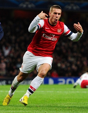 Podolski celebrtes after scoring for Arsenal