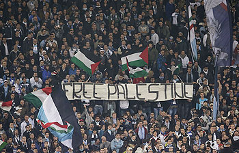 SS Lazio's fans display a banner that reads, Free Palestine during the Europa League soccer match against Tottenham at the Olympic stadium in Rome on Thursday