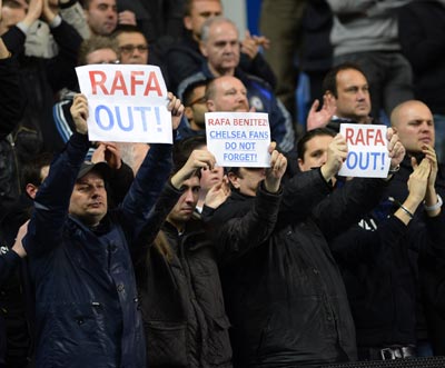 Chelsea fans hold up signs during their English Premier League soccer match against Manchester City