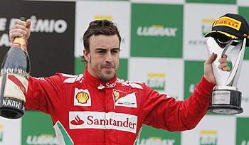Second placed Ferrari's Fernando Alonso celebrates after the Brazilian F1 Grand Prix at Interlagos circuit in Sao Paulo on Sunday