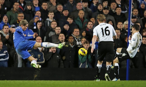 Chelsea's Torres (left) volleys a shot at goal against Fulham