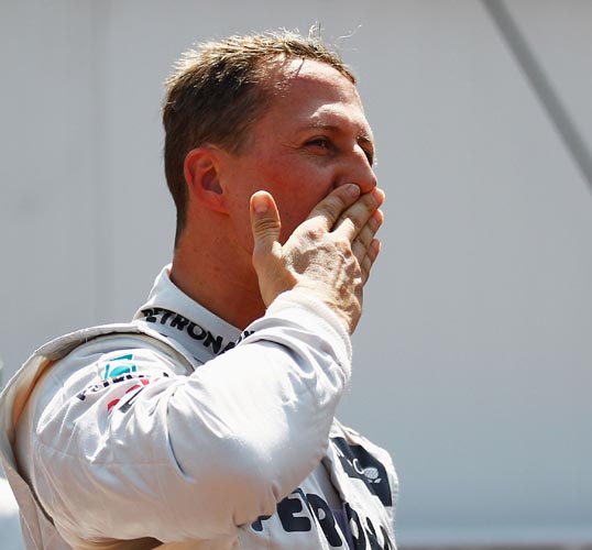 Michael Schumacher of Mercedes celebrates setting the fastest time before his five place grid penalty during qualifying for the Monaco GP at the Circuit de Monaco on May 26, 2012 in Monte Carlo