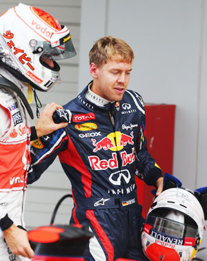 Pole sitter Sebastian Vettel (right) with Jenson Button