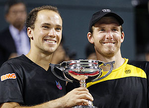 Alexander Peya (right) of Austria and Bruno Soares of Brazil pose with their trophy after winning the men's doubles finals match against Leander Paes of India and Radek Stepanek of the Czech Republic at the Japan Open on Sunday