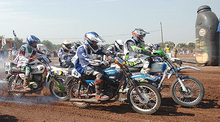 Riders pass the starting line at the start of a race at the Gulf Cup Dirt Track National Championship