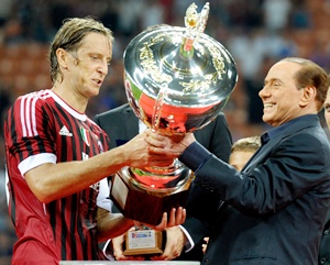 AC Milan chairman Silvio Berlusconi and Massimo Ambrosini celebrate
