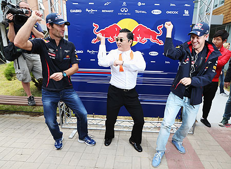 South Korean pop sensation Psy doing the Gangnam Style dance with Red Bull's Mark Webber and Sebastian Vettel