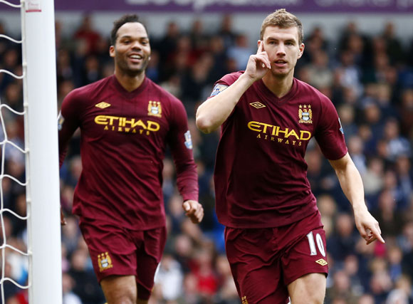 Manchester City's Edin Dzeko celebrates his goal against West Bromwich Albion during their English Premier League match at The Hawthorns