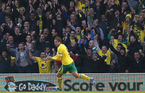 Grant Holt of Norwich City celebrates scoring against Arsenal