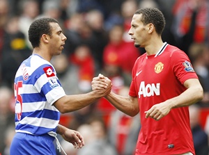 Manchester United's Rio Ferdinand (right) shakes hands with brotherAnton