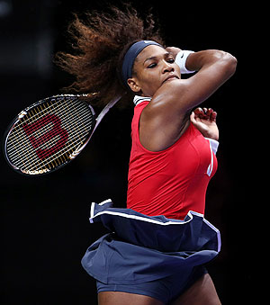 Serena Williams of USA plays a forehand in her match against Victoria Azarenka of Belarus