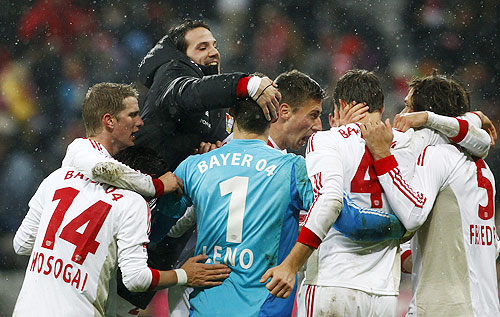 Bayer Leverkusen's players celebrate their victory against Bayern Munich on Sunday