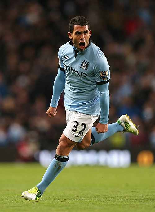 Carlos Tevez of Manchester City celebrates scoring the opening goal during the Barclays Premier League