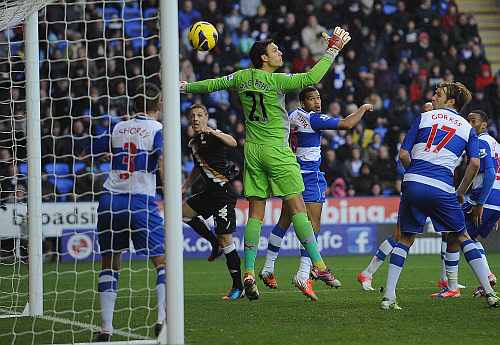 Chris Baird of Fulham watches as his header goes past goalkeeper Alex McCarthy of Reading for Fulham's second goal