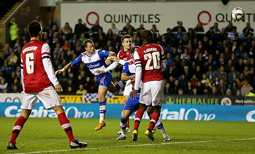 Noel Hunt of Reading scores off a header during the League Cup quarter against Arsenal on Tuesday
