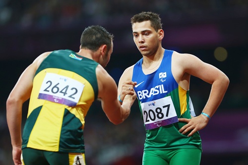 Alan Fonteles Cardoso Oliveira of Brazil is congratulated by Oscar Pistorius of South Africa