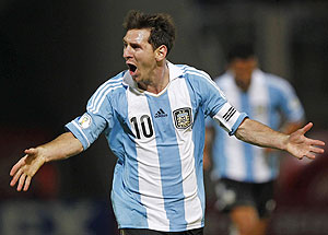 Argentina's Lionel Messi celebrates after scoring their third goal against Paraguay on Friday