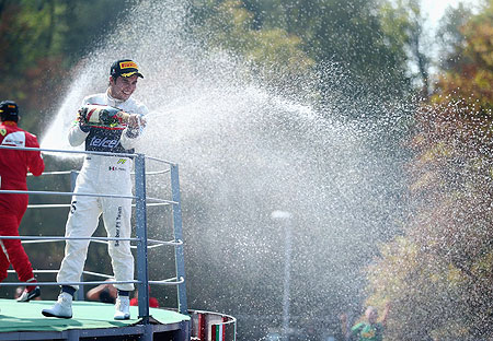 Sergio Perez of Sauber F1 celebrates on the podium after finishing second during the Italian Formula One Grand Prix on Sunday