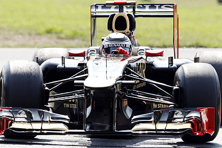 Lotus Formula One driver Kimi Raikkonen steers his car