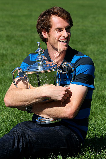 Andy Murray of Great Britain poses with the US Open Championship trophy in Central Park