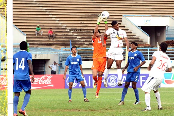 Pronoy Halder  of Pailan Arrows (3rd right) heads the ball as Dempo goalkeeper Subhashish Roy Chowdhury tries to catch