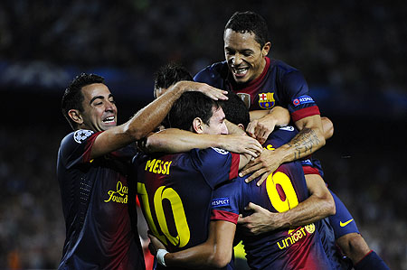 Lionel Messi of FC Barcelona (centre) celebrates with his teammates after scoring the winner against FC Spartak Moscow on Wednesday