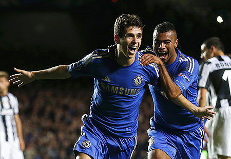 Chelsea's Oscar (left) celebrates with teammate Ashley Cole after scoring against Juventus