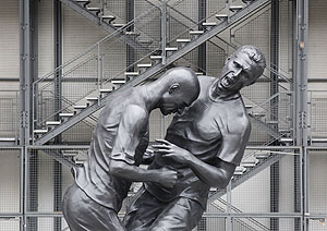 A statue prepared by artist Adel Abdessemed, depicting former French national soccer team player Zinedine Zidane's (left) head-butting Italian defender Marco Materazzi during the 2006 World Cup final, is seen in front of the Centre Pompidou modern art museum in Paris