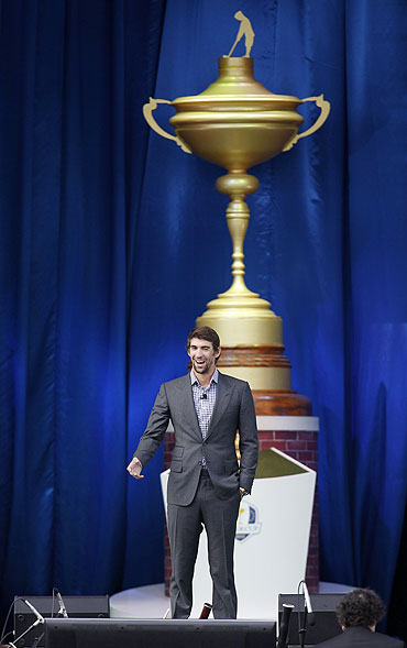 U.S. Olympian Michael Phelps speaks at the start of the opening ceremony for the 39th Ryder Cup golf matches at the Medinah Country Club in Medinah, Illinois