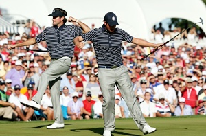 Webb Simpson (right) and Bubba Watson of the USA celebrate