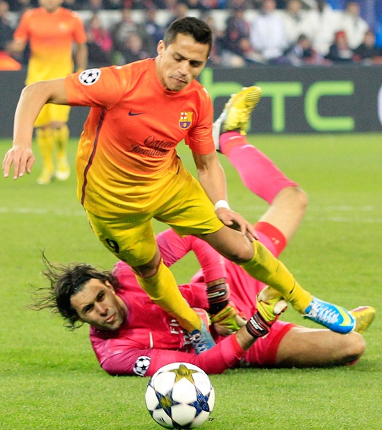 Paris St Germain's goalkeeper Salvatore Sirigu provokes the penalty against Barcelona's Alexis Sanchez