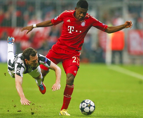 Juventus' Stephan Lichtsteiner (left) fights for the ball with Bayern Munich's David Alaba