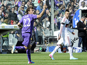 Adem Ljajic of ACF Fiorentina (left) celebrates after scoring his team's first goal from a penalty during their Serie A match against AC Milan at Stadio Artemio Franchi in Florence on Sunday