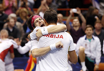 Serbia's Ilija Bozoljac (left) and Nenad Zimonjic celebrate after defeating United States' Mike Bryan and Bob Bryan during their Davis Cup doubles quarter-final match in Boise, Idaho, on Saturday