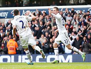 Gylfi Sigurdsson of Tottenham Hotspur celebrates with teammate Clint Dempsey after scoring against Everton at White Hart Lane on Sunday