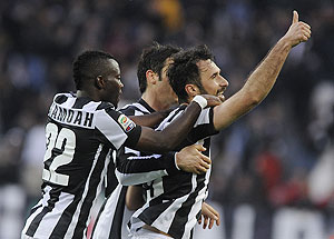 Juventus' Mirko Vucinic (right) celebrates with teammates after scoring against Pescara during their Serie A match at the Juventus stadium in Turin on Saturday